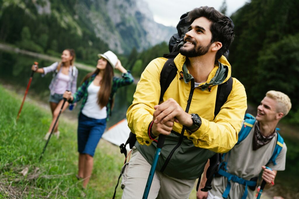 Group of friends on a hiking, camping trip in the mountains