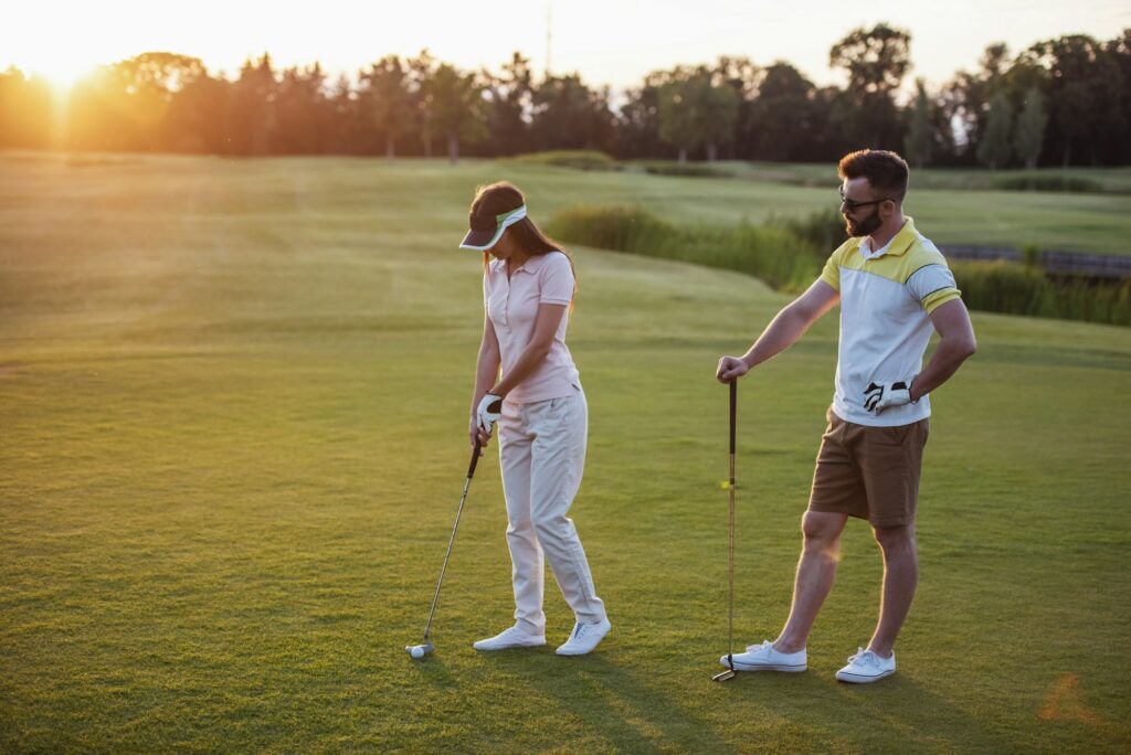 Couple playing golf