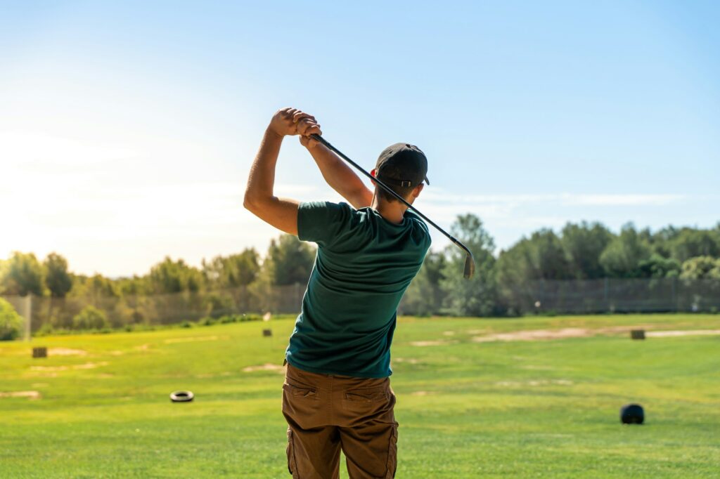 Golf hit in a wide golf course in summer.